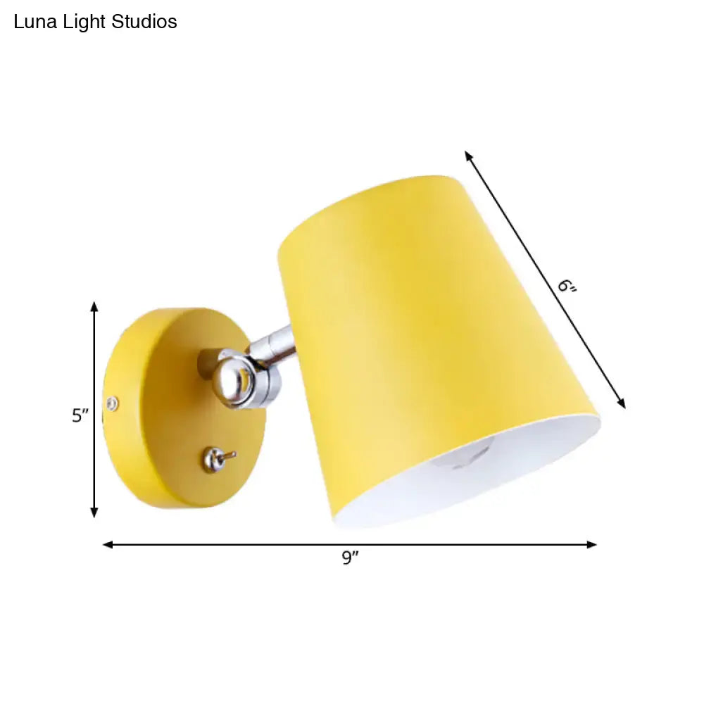 Modern yellow metal shade sconce light with cylindrical spotlight and chrome adjustable arm for bedroom walls