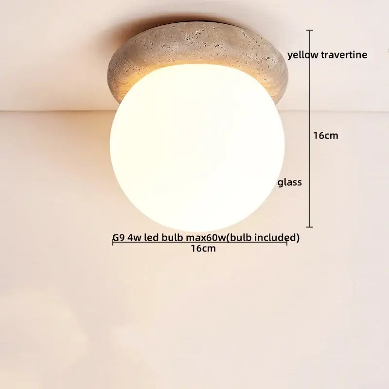 Modern yellow travertine glass ball led ceiling light with a rounded globe and textured base for dining room decorbites ceiling light