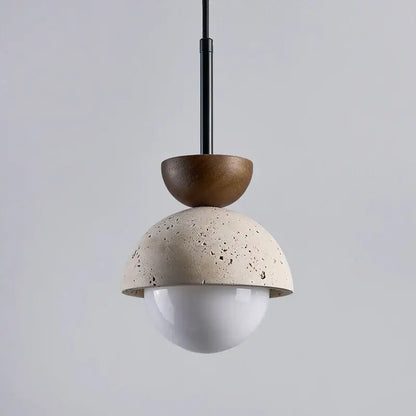 Modern pendant lights featuring a matte beige concrete dome and wooden half-sphere for kitchen island decorbites yellow travertine led