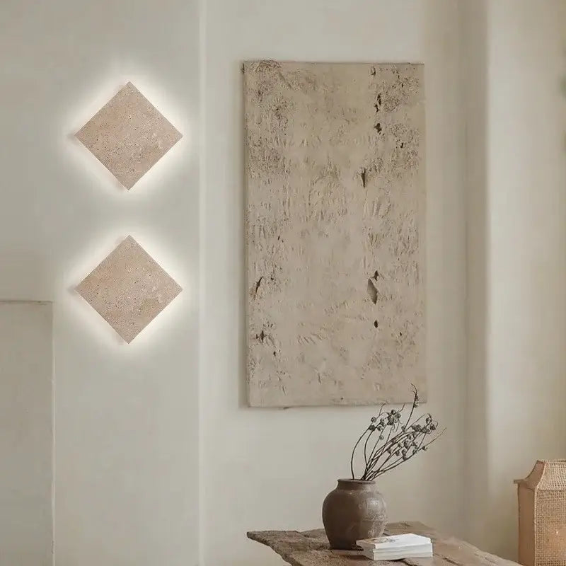 Two beige yellow travertine square led wall lamp sconces with stone texture designed as modern stair wall lamps