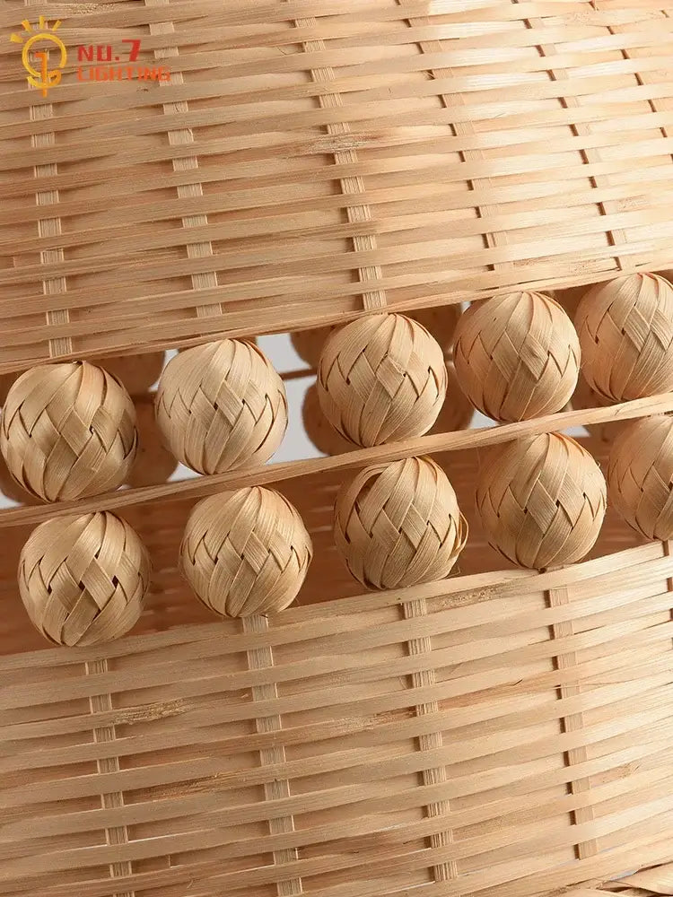 Handwoven natural bamboo massage balls in a matching woven basket complement a modern zen bamboo weave pendant light