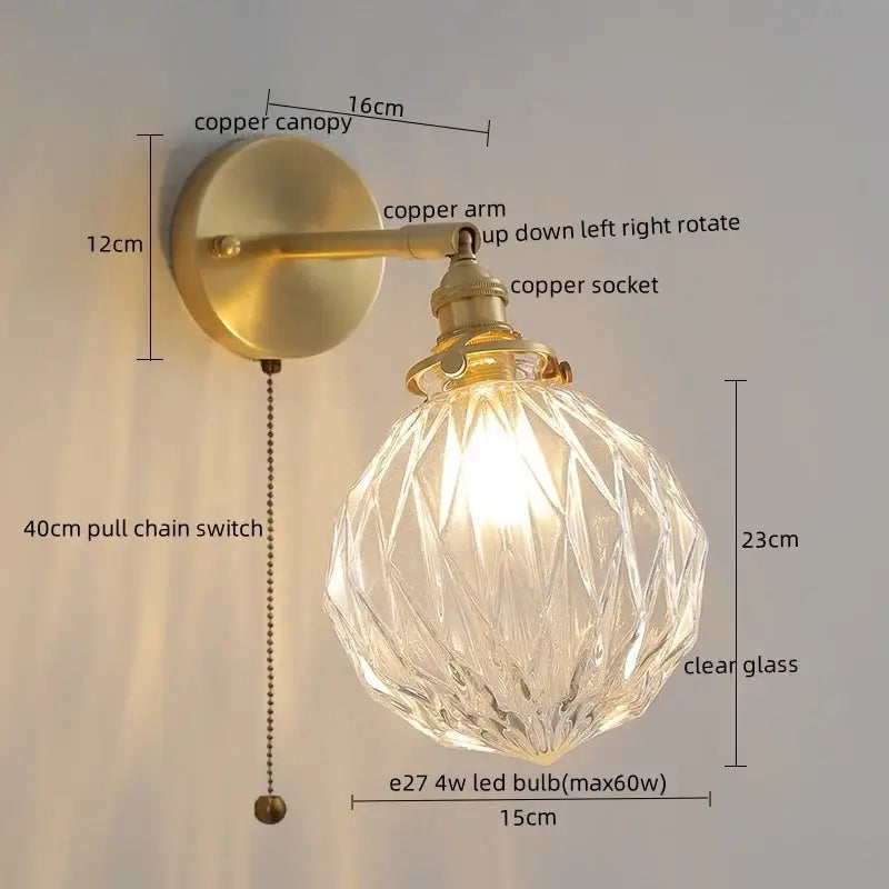 Vintage-style wall lamp with brass copper arm and clear glass globe complementing modern zigzag green glass led bedroom light
