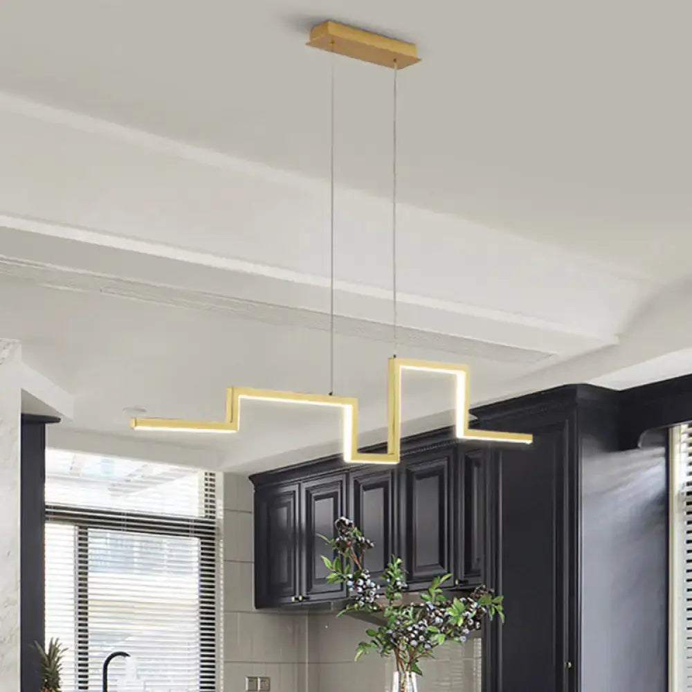 Modern gold zigzag linear metal hanging light fixture with sleek metallic finish for dining room use