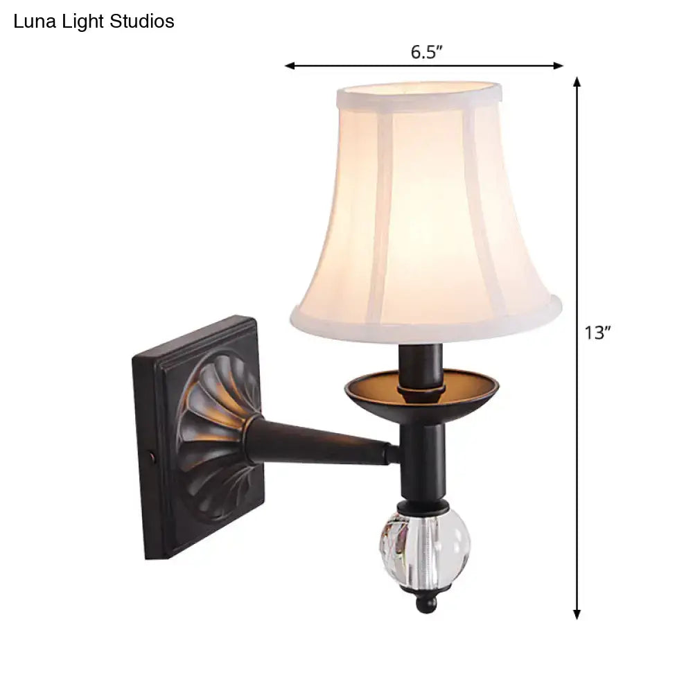 Classic black wrought iron modernist bell wall light with clear crystal globe and white fabric lampshade for bedroom use