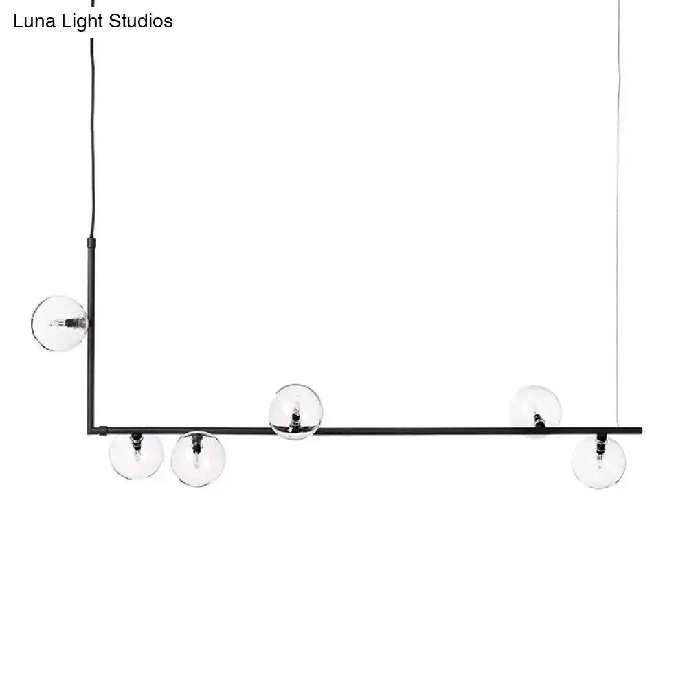 DecorBites modernist black metal chandelier with five clear glass globe bulbs and right angled frame in warm white lighting