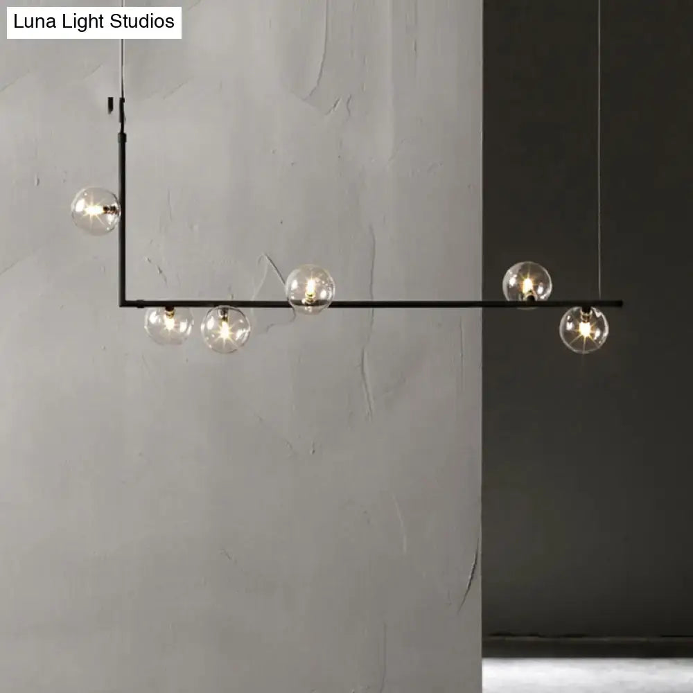 Modern black metal pendant light with five clear glass globe bulbs for stylish interior lighting