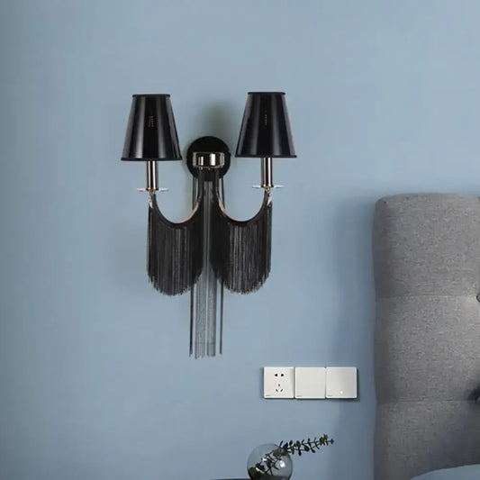 Modernist black and silver tassel wall sconce with black fringes and two conical shades compatible with e12 bulbs