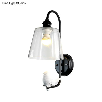 Modernist black metal cone wall lamp with clear glass shade and white ceramic bird figurine for bedroom use