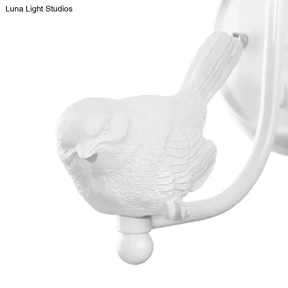 White ceramic bird-shaped cone wall lamp with detailed feather texture and curved arm for modernist bedroom decor