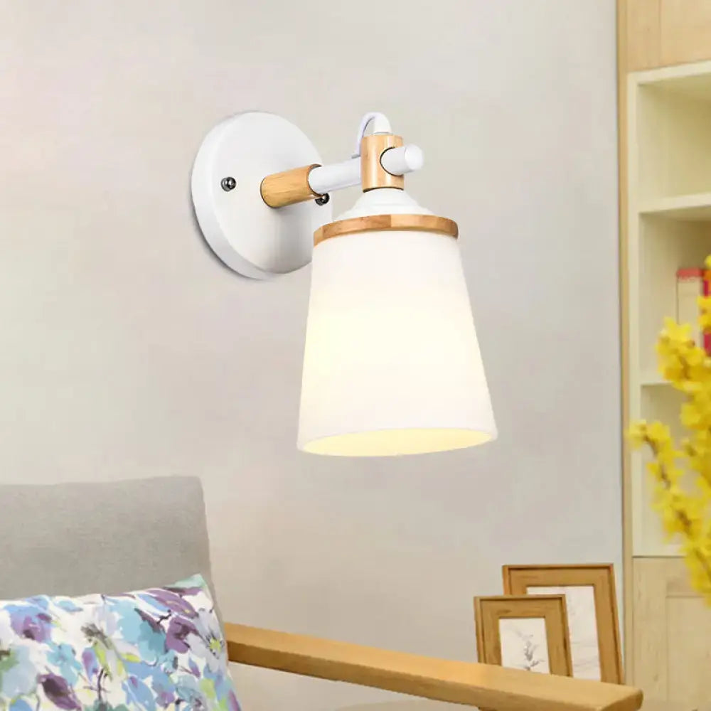 Modernist wall lamp with white black wooden accent and cream glass shade, ideal for bedroom lighting