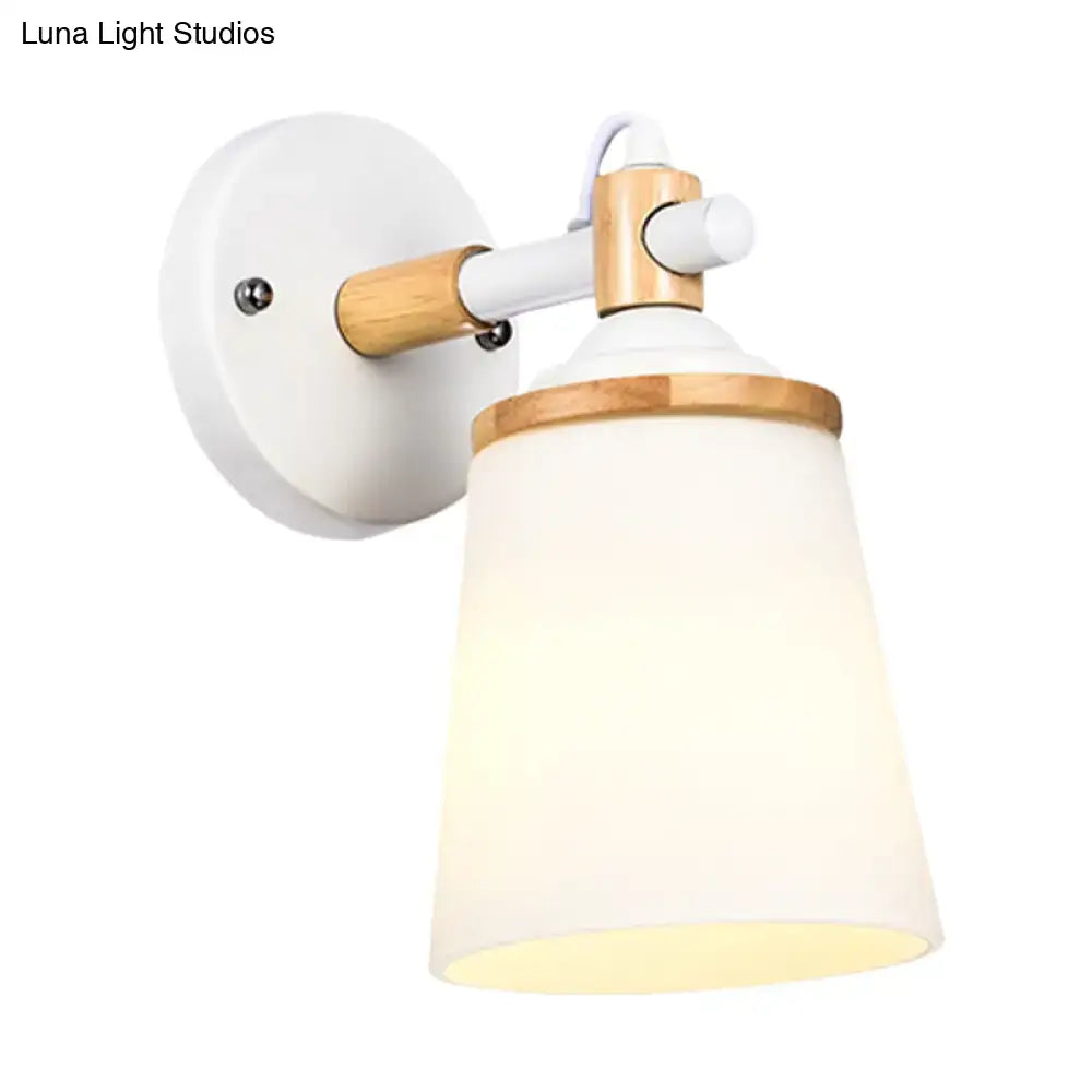 Modernist wall lamp with white and bamboo finish and cream glass shade for bedroom lighting