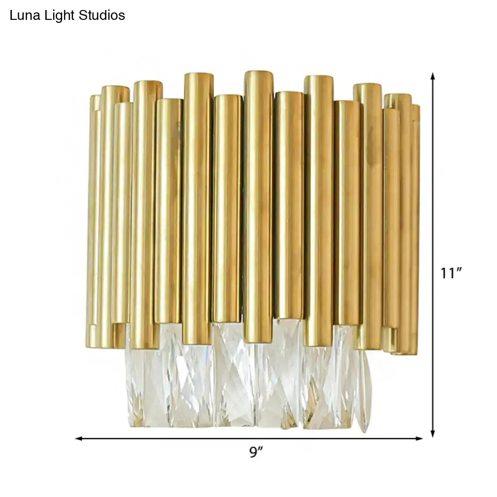 Modernist brass wall light with gold-toned rods and clear faceted crystal accents for living room lighting