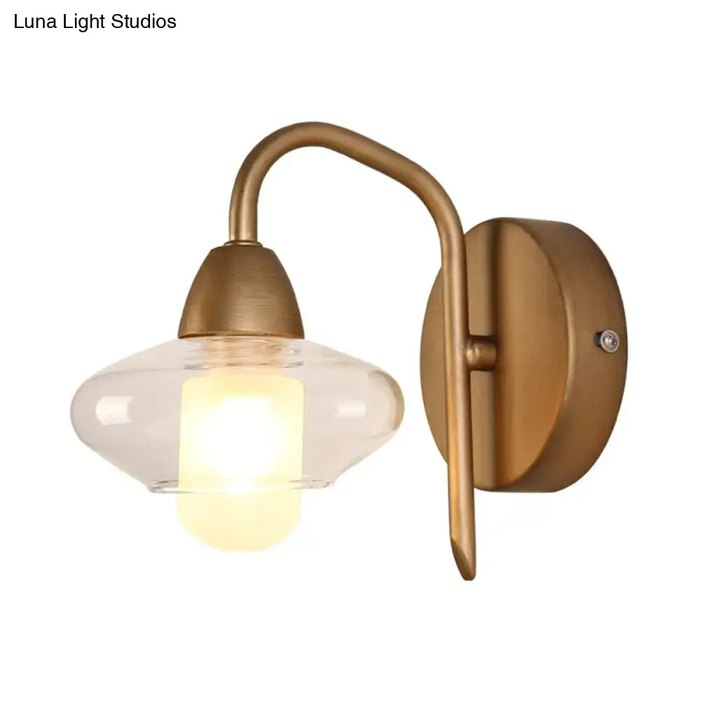 Antique brass wall lamp with clear glass shade and exposed bulb base modernist bedroom sconce design