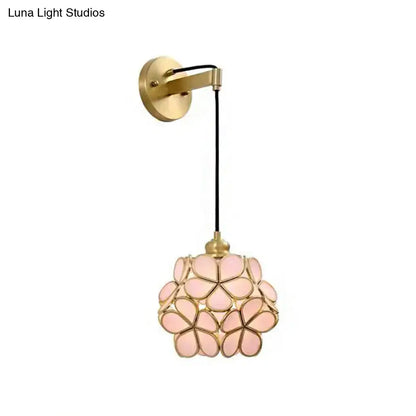 Modernist brass floral glass bulb bedside sconce with light pink and clear petals and brass wall mount