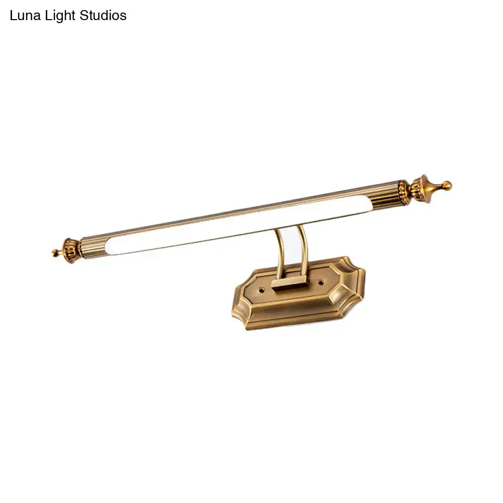 Antique brass-finished led vanity light fixture with sleek design and ornate ends for modernist bathroom use