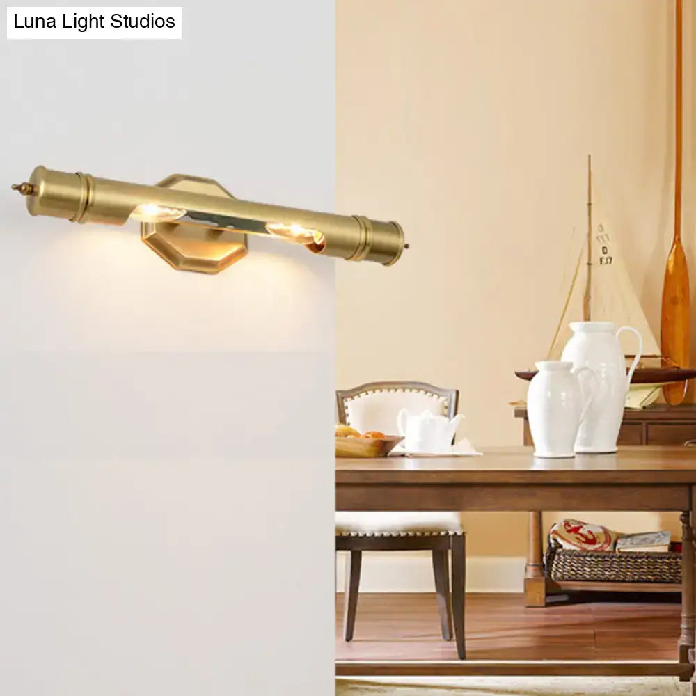 Modernist brass tube wall sconce with hexagonal backplate designed for 110-120v and maximum bulb wattage use