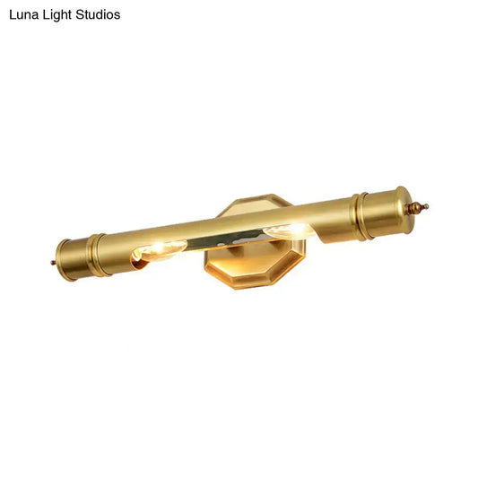 Brass-finished modernist wall sconce with cylindrical design and hexagonal backplate for 110-120v maximum bulb wattage