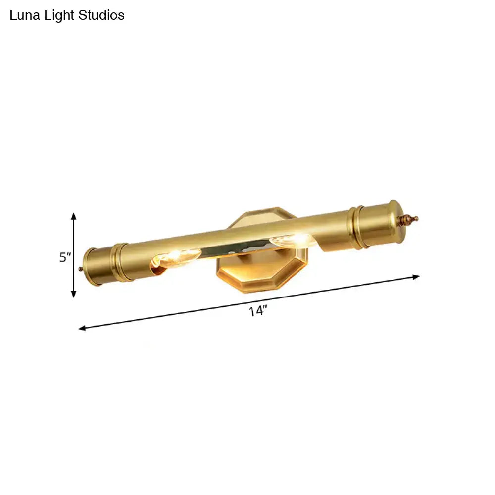 Brass-finished modernist wall sconce with cylindrical design and hexagonal backplate for 110-120v maximum bulb wattage