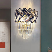 Modernist chrome and crystal wall sconce with braided polished chrome and cascading faceted glass crystals for family room