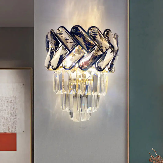 Modernist chrome and crystal wall sconce with braided polished chrome and cascading faceted glass crystals for family room