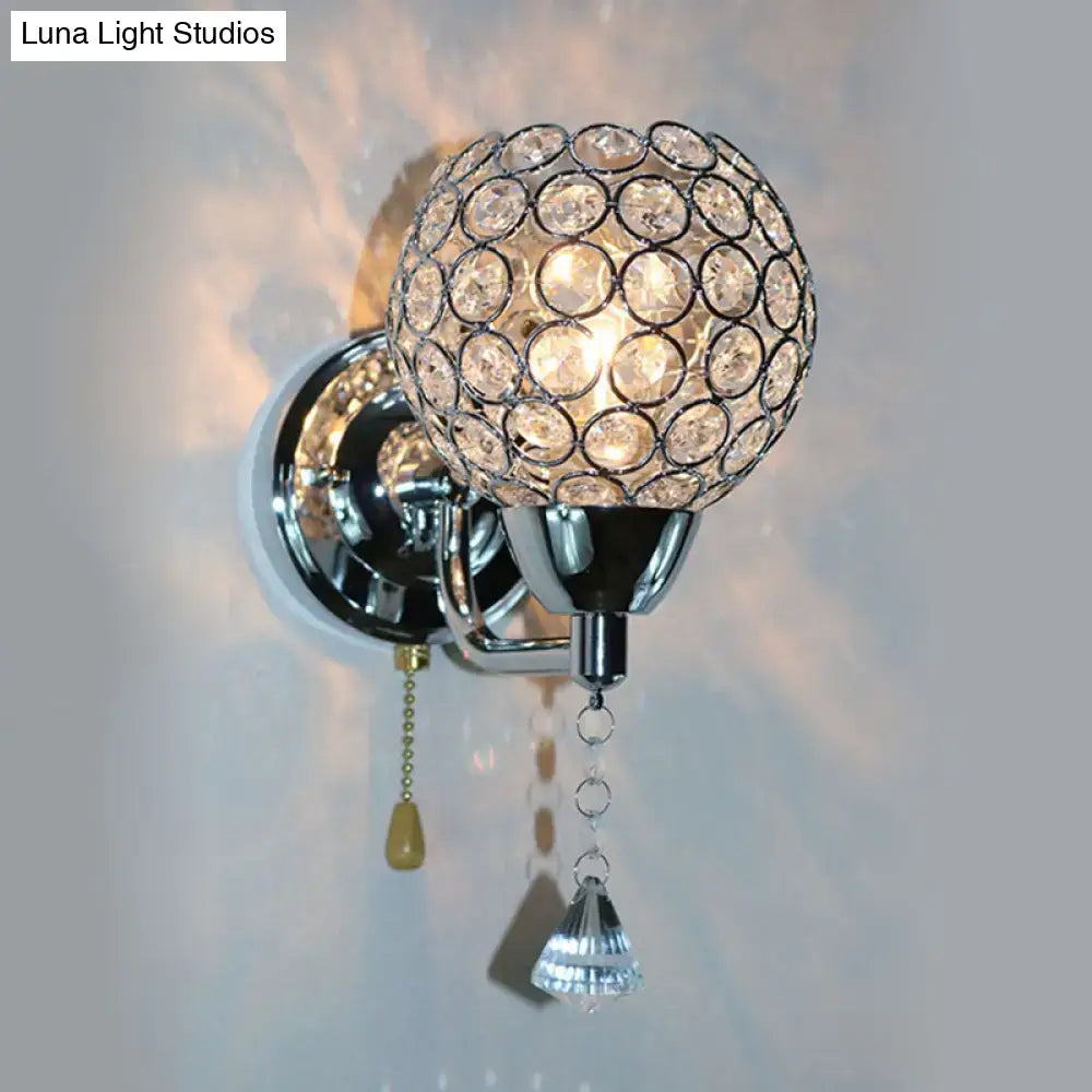 Modernist chrome and crystal wall sconce light with spherical globe and teardrop crystals direct wired electric fixture
