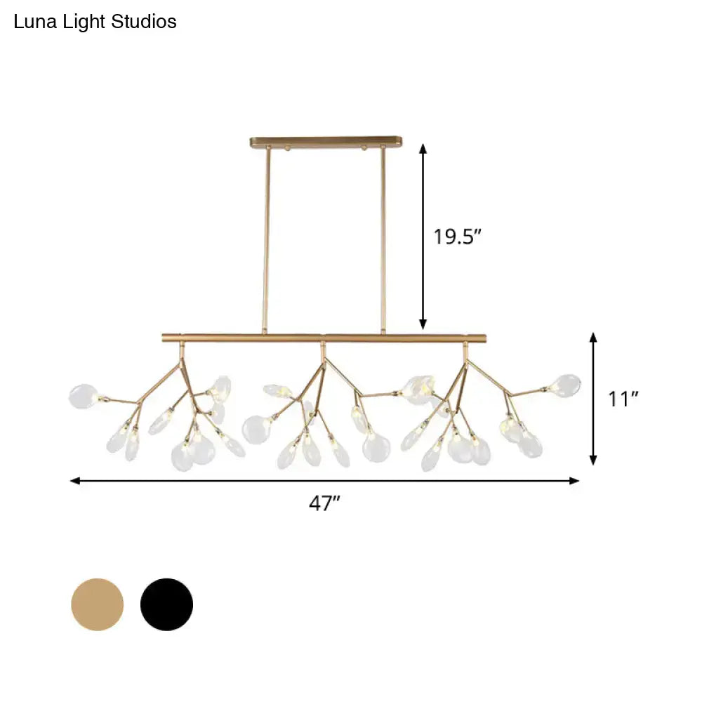 Gold-toned branch-style chandelier with modernist clear glass teardrop pendants in decorbites firefly hanging island light