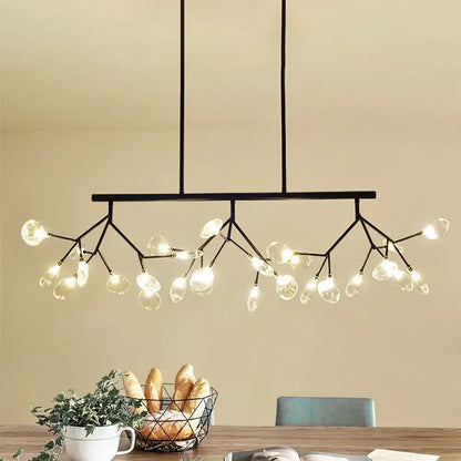 Black metal firefly hanging island chandelier with branching arms and clear modernist glass globe bulbs in black gold