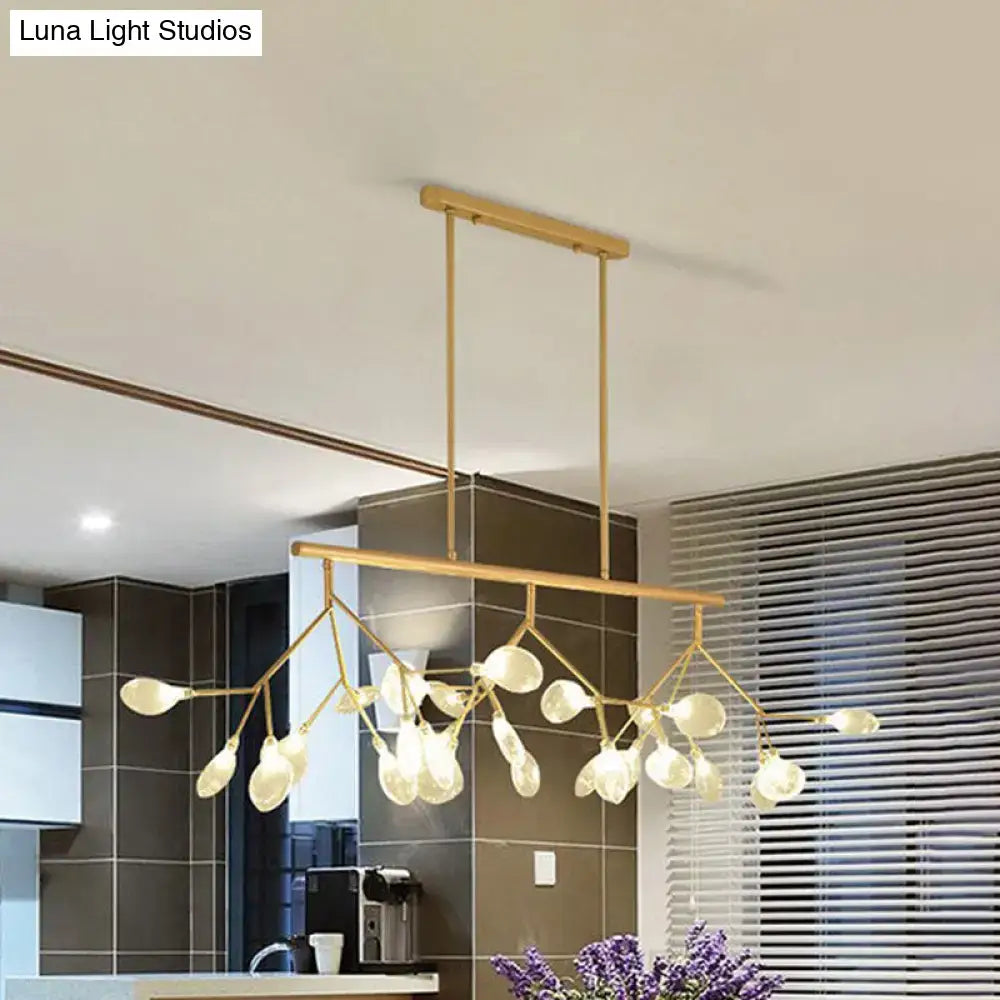 Gold-toned decorbites™ firefly hanging island light with modernist clear glass globes and delicate branch-like arms