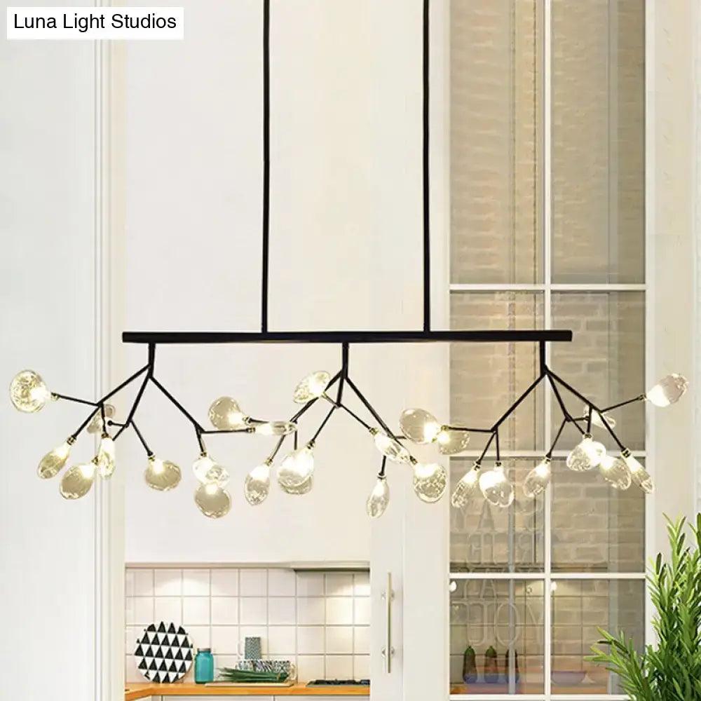 Black metal firefly hanging island light with branching arms and modernist clear glass teardrop bulbs in black and gold