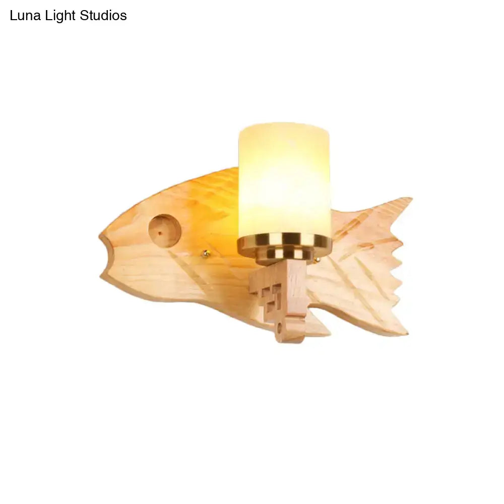 Modernist fish wood backplate bedroom wall sconce with cracked glass frosted lampshade and warm-toned brass accents