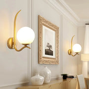 Modernist gold sconce light with a curved arm and white glass frosted globe shade for bedroom 220v-240v