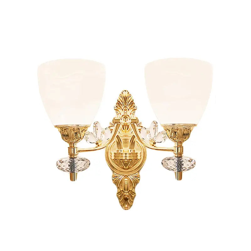 Modernist gold finish crystal wall light with ornate design, two frosted glass shades, and standard bulb base