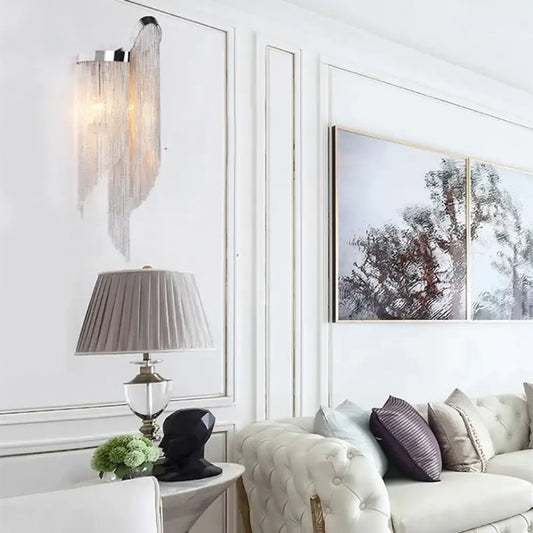 Modernist silver-framed aluminum tassel wall sconce with cascading sheer fabric strands for living room light