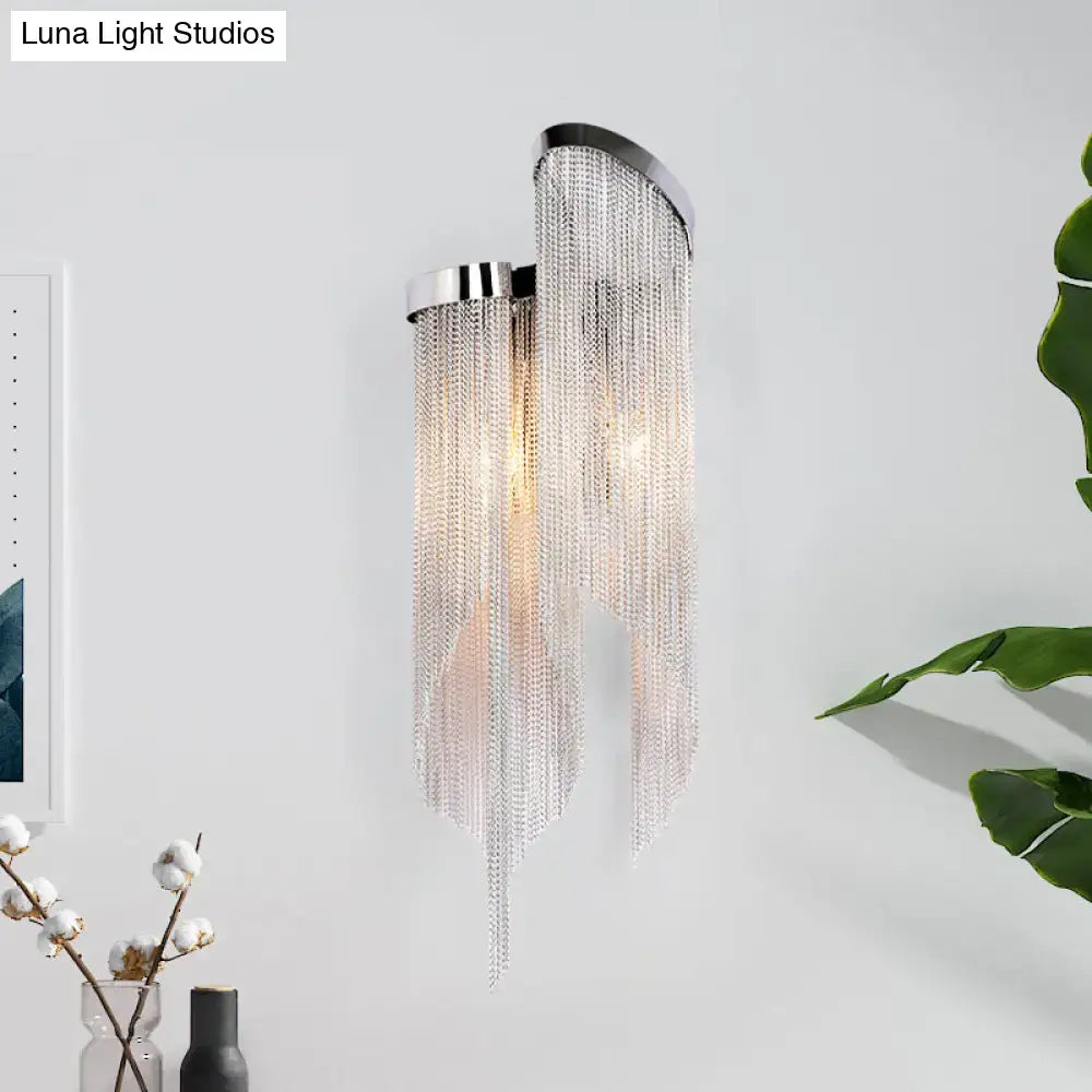 Modernist aluminum tassel wall sconce with sleek chrome finish and clear crystal chains for living room lighting