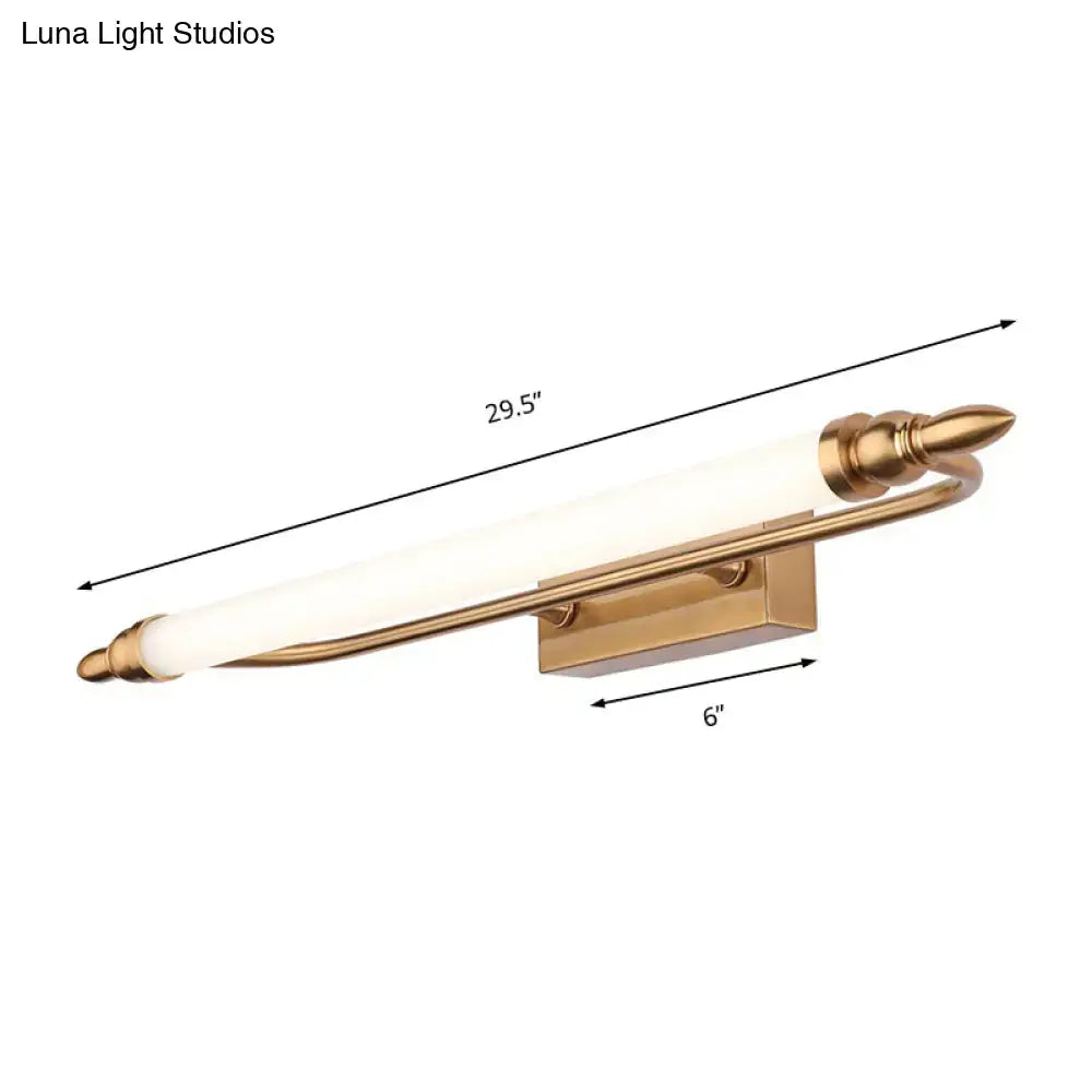 Modernist gold tube metal vanity wall light with frosted glass cylinder and ornate spearhead ends for bathroom use