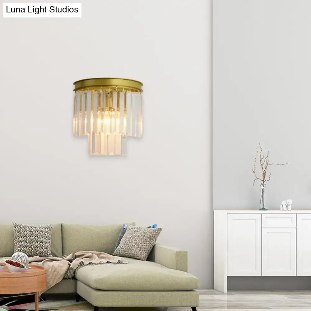 Modernist gold wall lamp featuring cascading clear faceted crystal prisms ideal for living room lighting