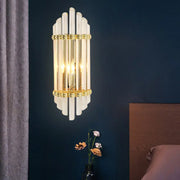 Elegant gold wall sconce lamp with vertical frosted crystal tubes and brass accents for bedroom 220v-240v use