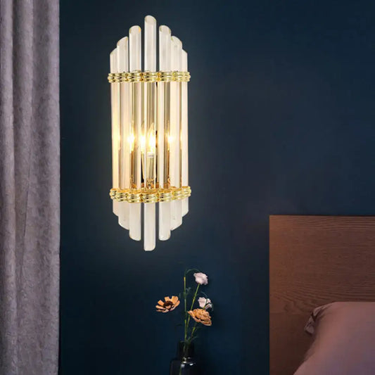 Elegant gold wall sconce lamp with vertical frosted crystal tubes and brass accents for bedroom 220v-240v use