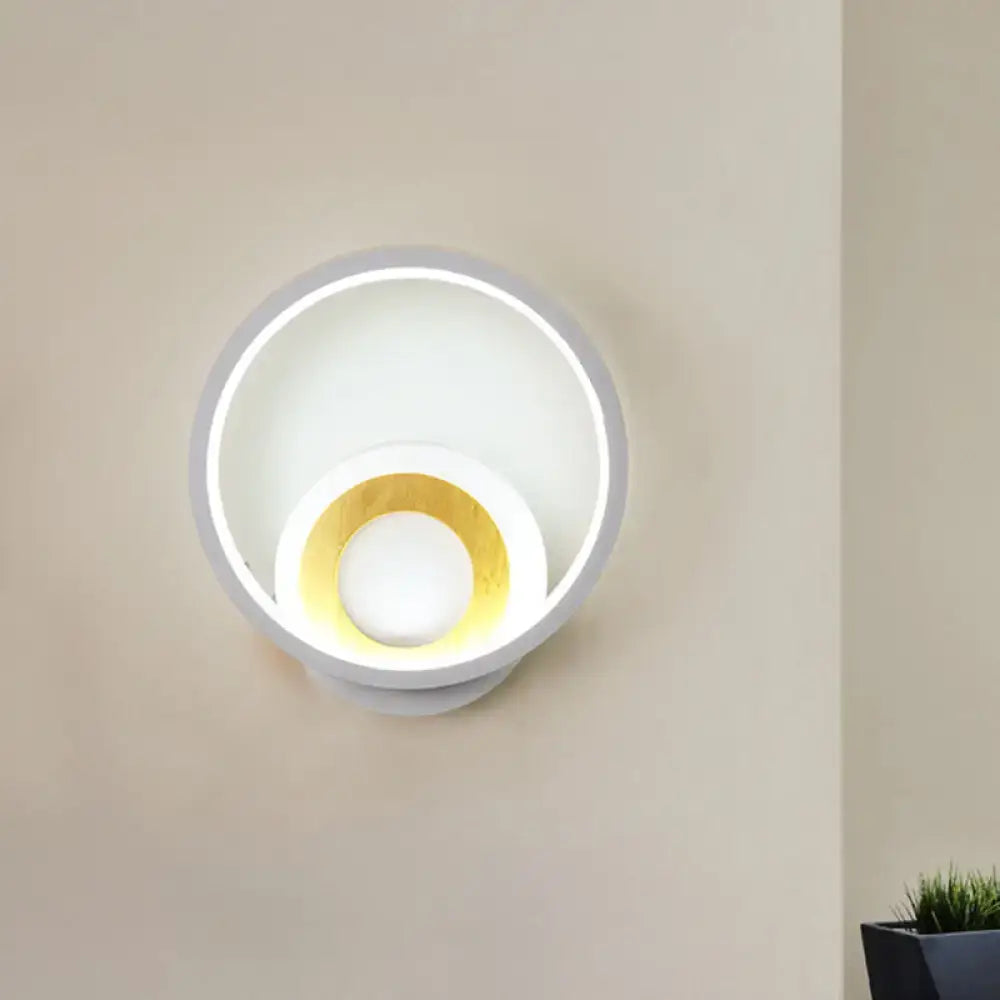 Modernist gray and wood ring wall sconce with matte white and gold concentric rings for bedroom led light