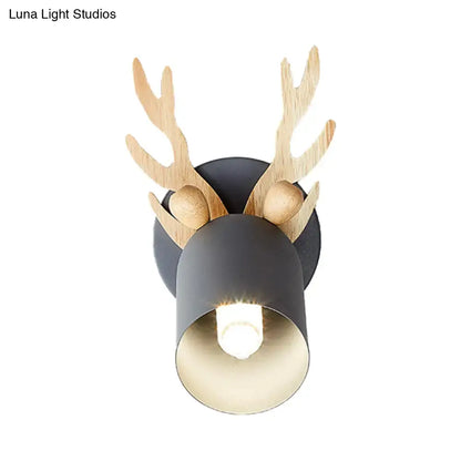 A rustic deer-head wall sconce with light wooden antlers and matte black cylinder shape shade for 110v-120v or 220v-240v use