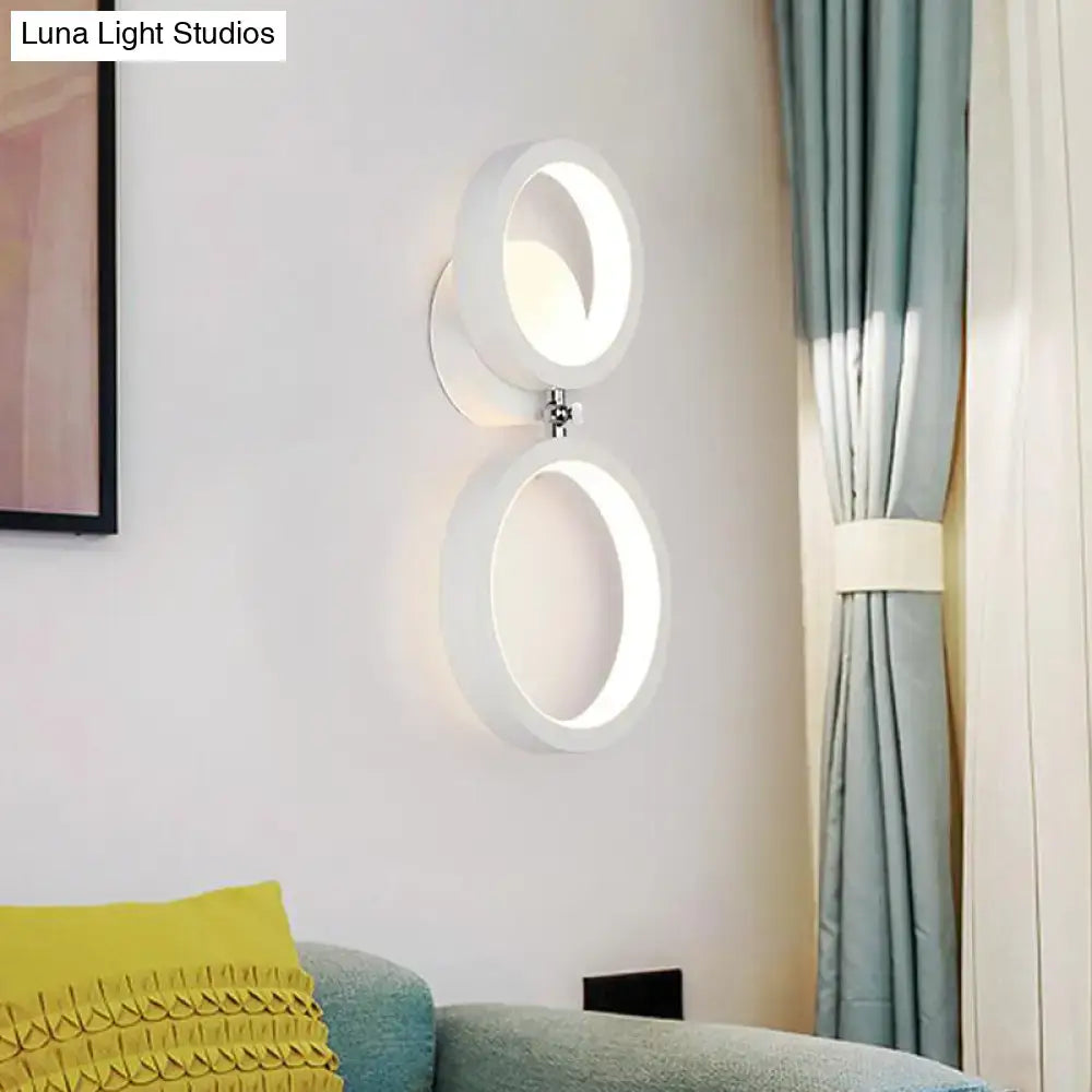 Modernist matte beige wall lamp with two stacked circular rings and chrome accent for bedroom corners