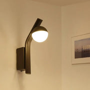 Modernist orb sconce wall lamp with black curved arm and frosted glass orb shade for stairway lighting