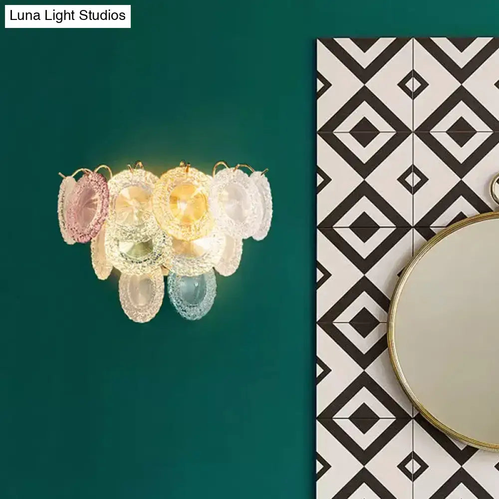 Modernist pink and blue layered disc wall light with pastel translucent glass and gold accents for dining room use