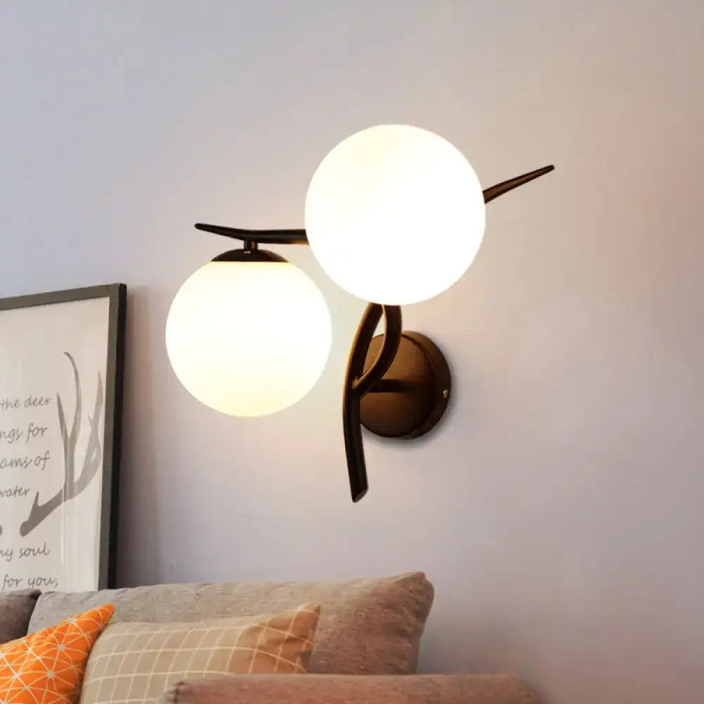 Modernist silver black light fixture with brass finish and milky glass globe shades for bedroom wall mounting