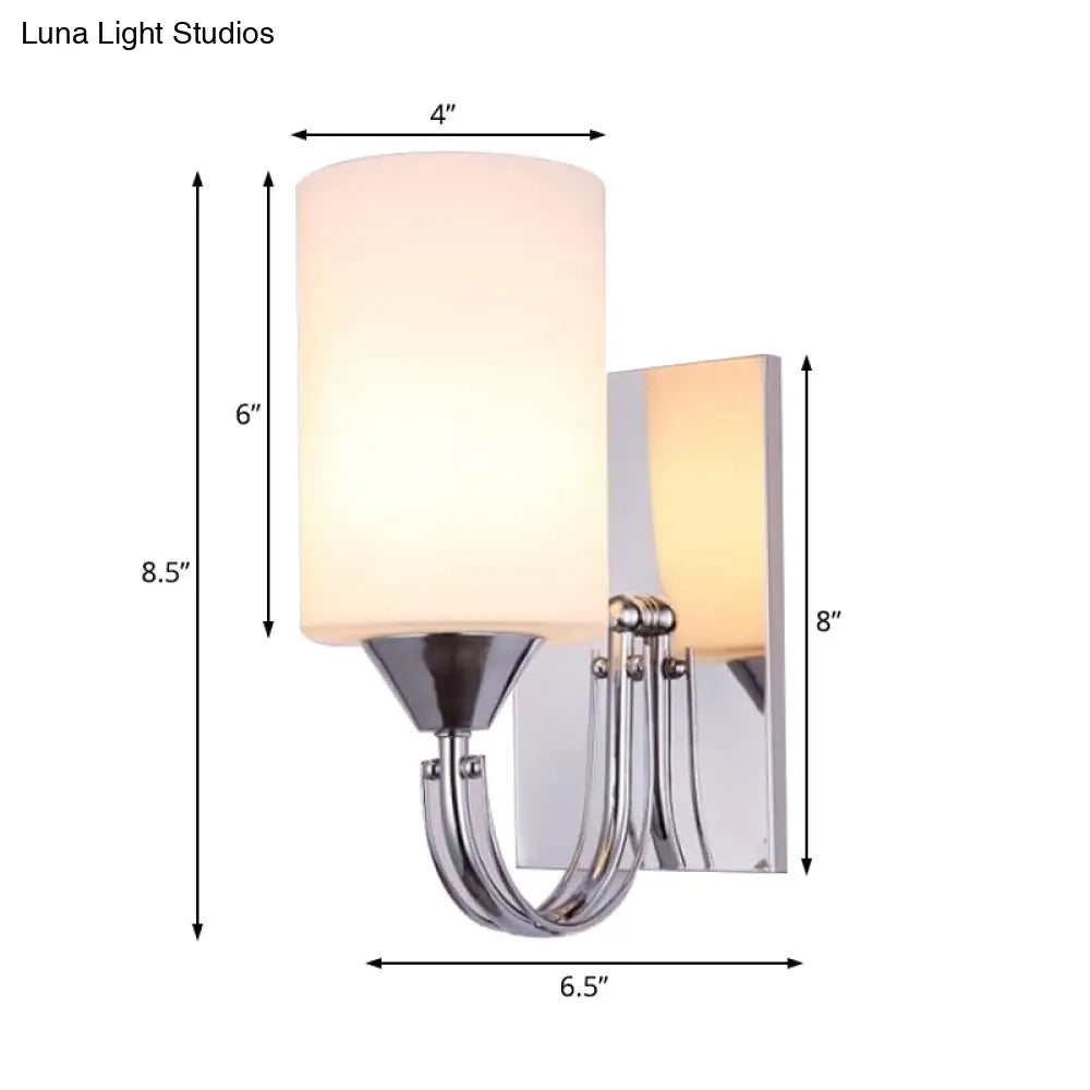 DecorBites™ DecorBites™ Modernist Silver Cylindrical Sconce Light: Wall-Mounted Lamp with Curved Arm & White Glass Shade