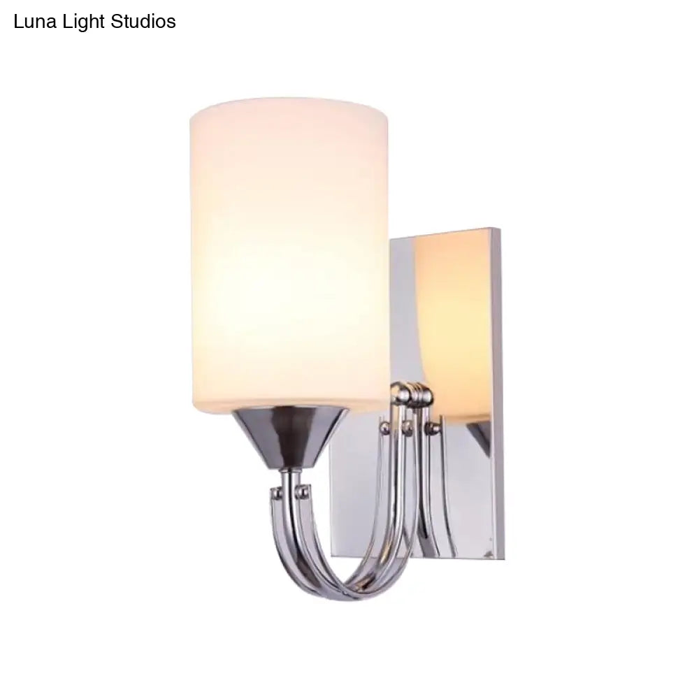 DecorBites™ DecorBites™ Modernist Silver Cylindrical Sconce Light: Wall-Mounted Lamp with Curved Arm & White Glass Shade