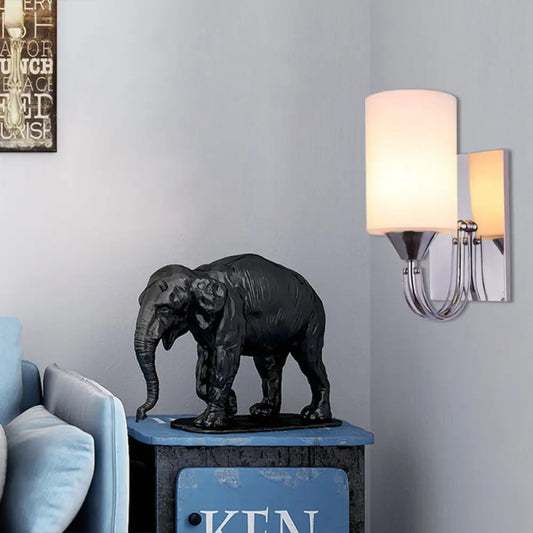 DecorBites™ DecorBites™ Modernist Silver Cylindrical Sconce Light: Wall-Mounted Lamp with Curved Arm & White Glass Shade