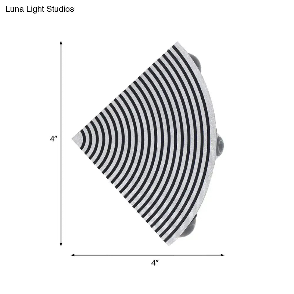 Modernist striped black and silver wall lamp with concentric black and white stripes and sleek metallic finish for living room