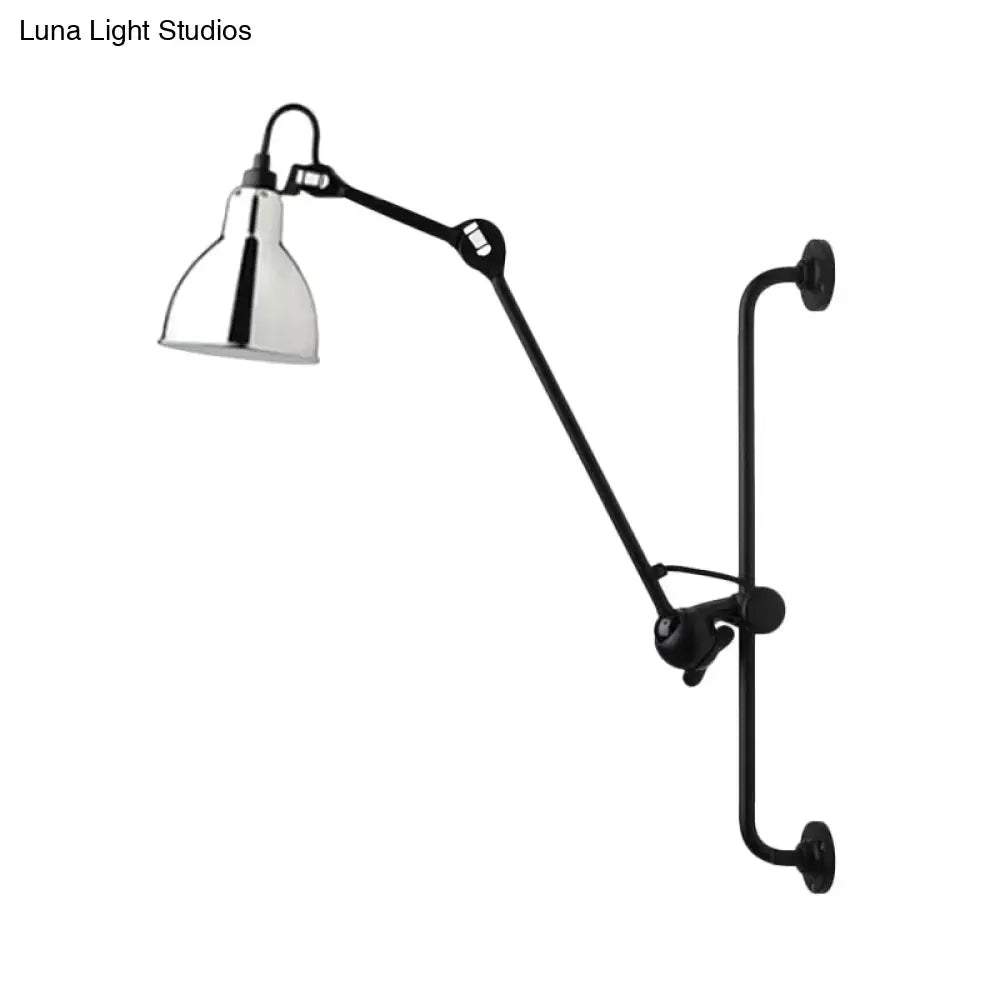 Black articulated modernist style wall light with polished chrome shade in black and white for dining room use