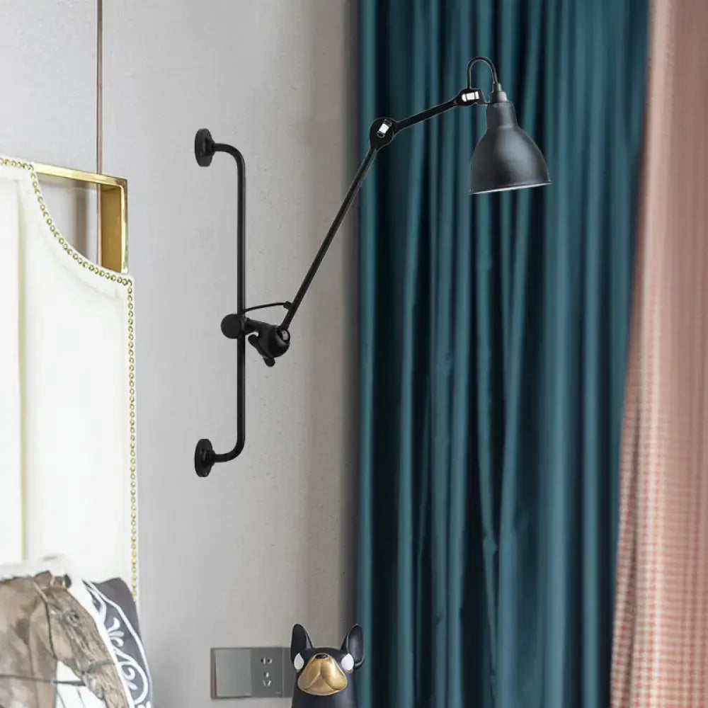 Black industrial-style adjustable wall light with matte finish and articulated arm in modernist style for dining room